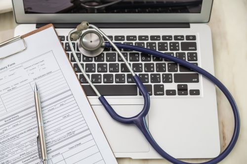 Medical coder reviewing 2025 ICD-10 and CPT code changes